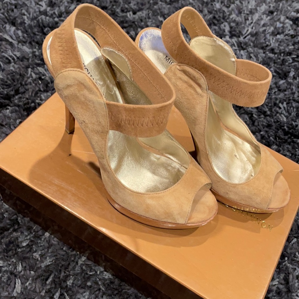 Beige open toe heels with elastic ankle band.